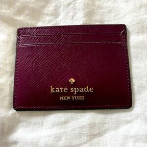 kate spade burgundy leather card case with gold logo